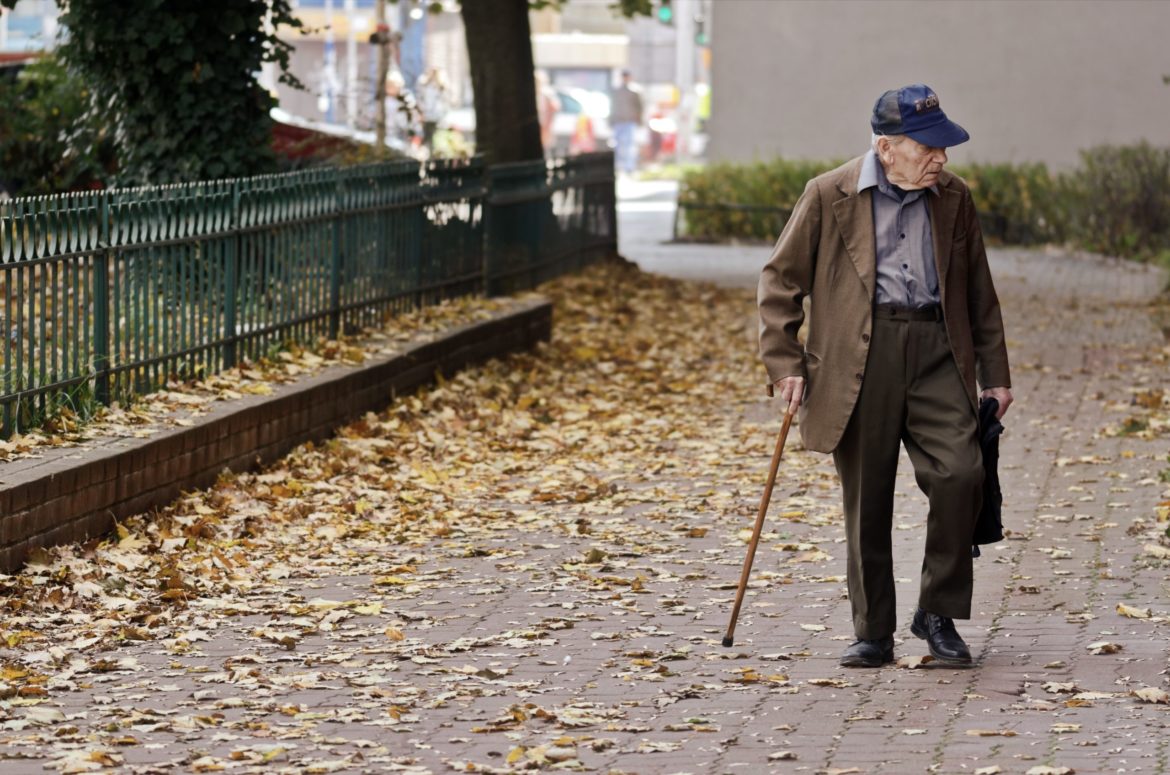 photo-of-elderly-man-walking-on-pavement-3093287-scaled.jpg